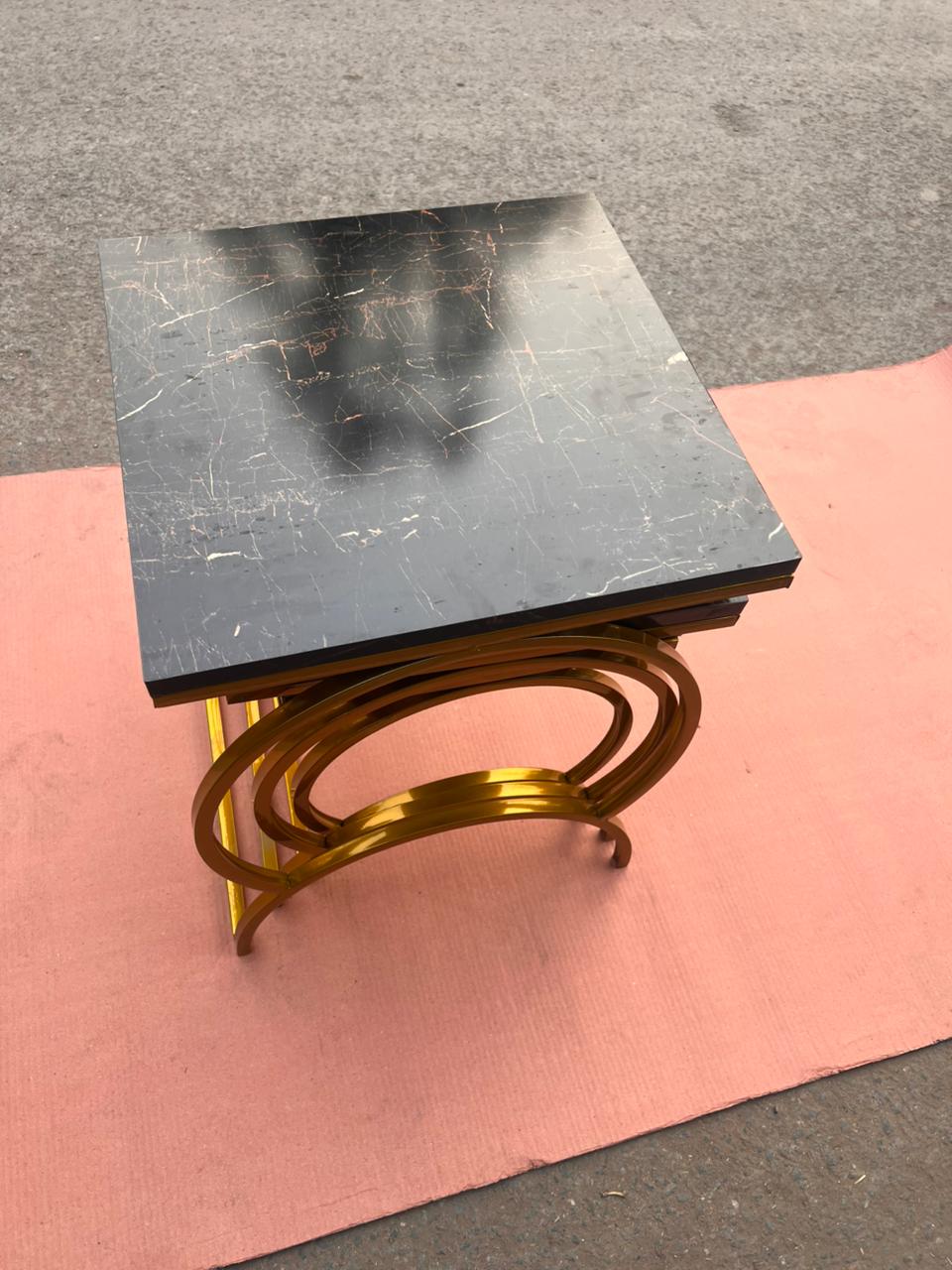 Modern Luxury Nesting Table Set Featuring Golden Metal Base and Smooth Marble Texture Tops