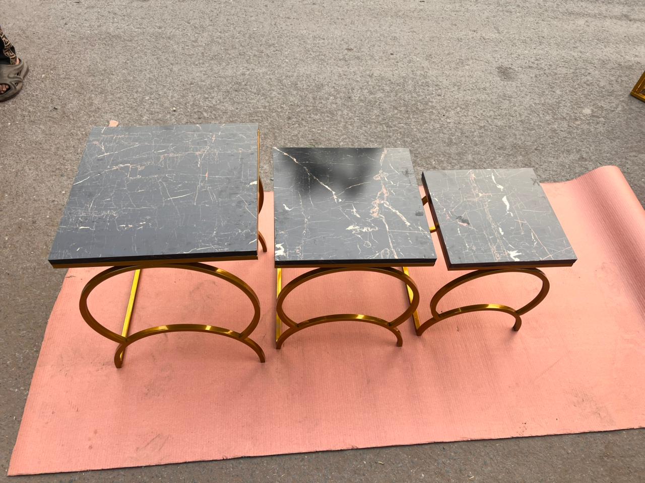 Modern Luxury Nesting Table Set Featuring Golden Metal Base and Smooth Marble Texture Tops