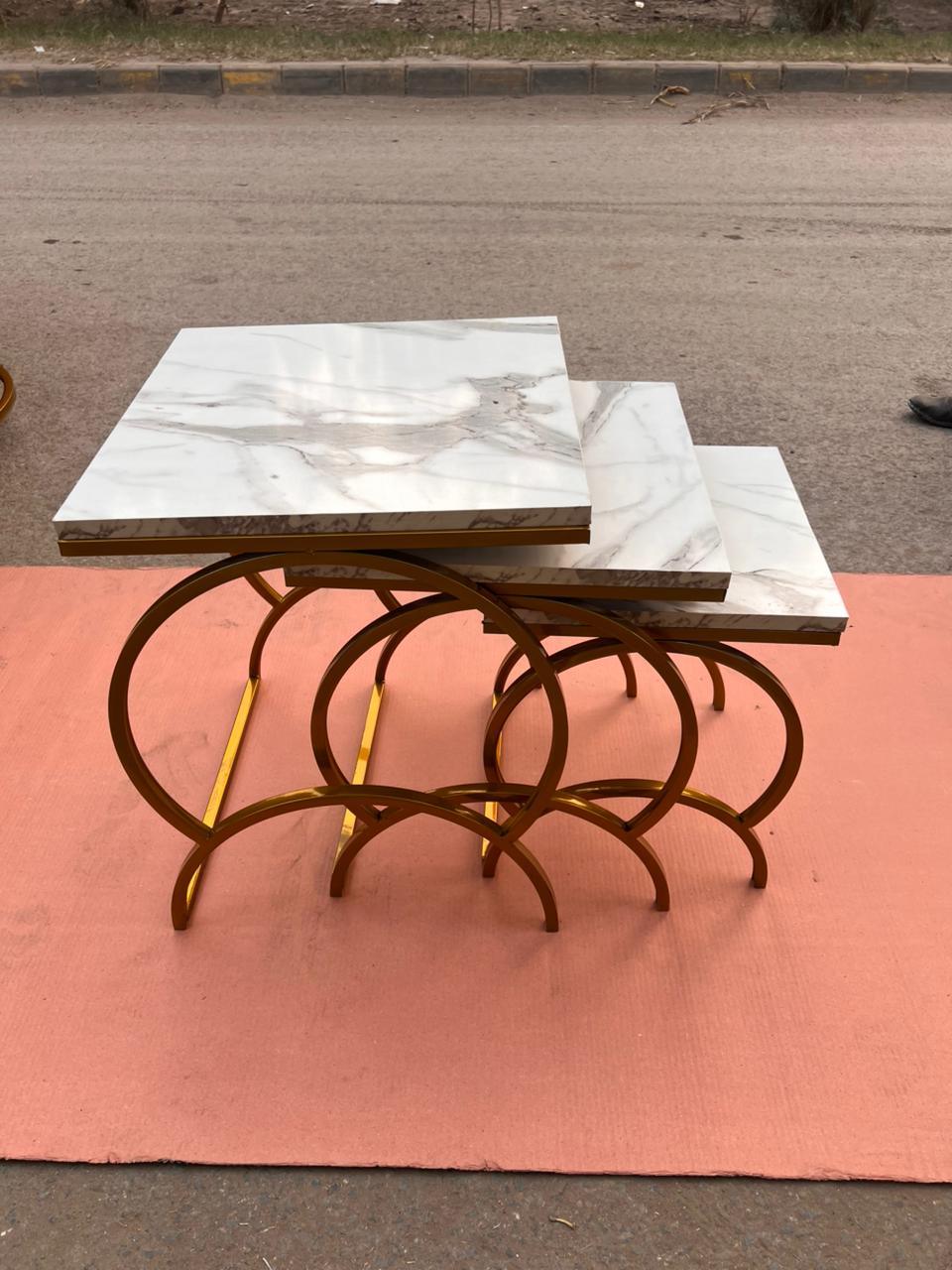Modern Luxury Nesting Table Set Featuring Golden Metal Base and Smooth Marble Texture Tops