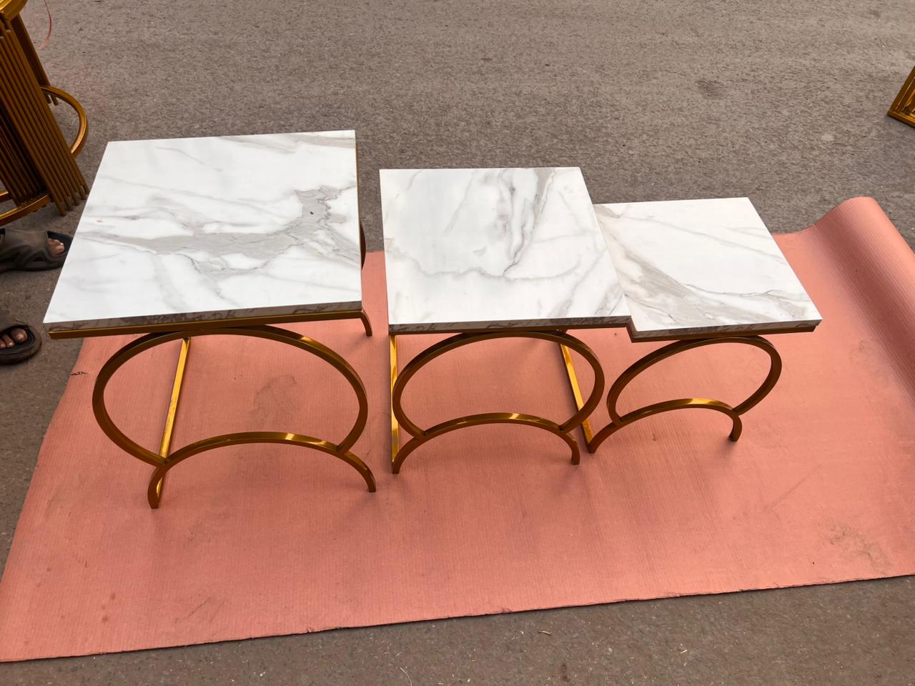 Modern Luxury Nesting Table Set Featuring Golden Metal Base and Smooth Marble Texture Tops