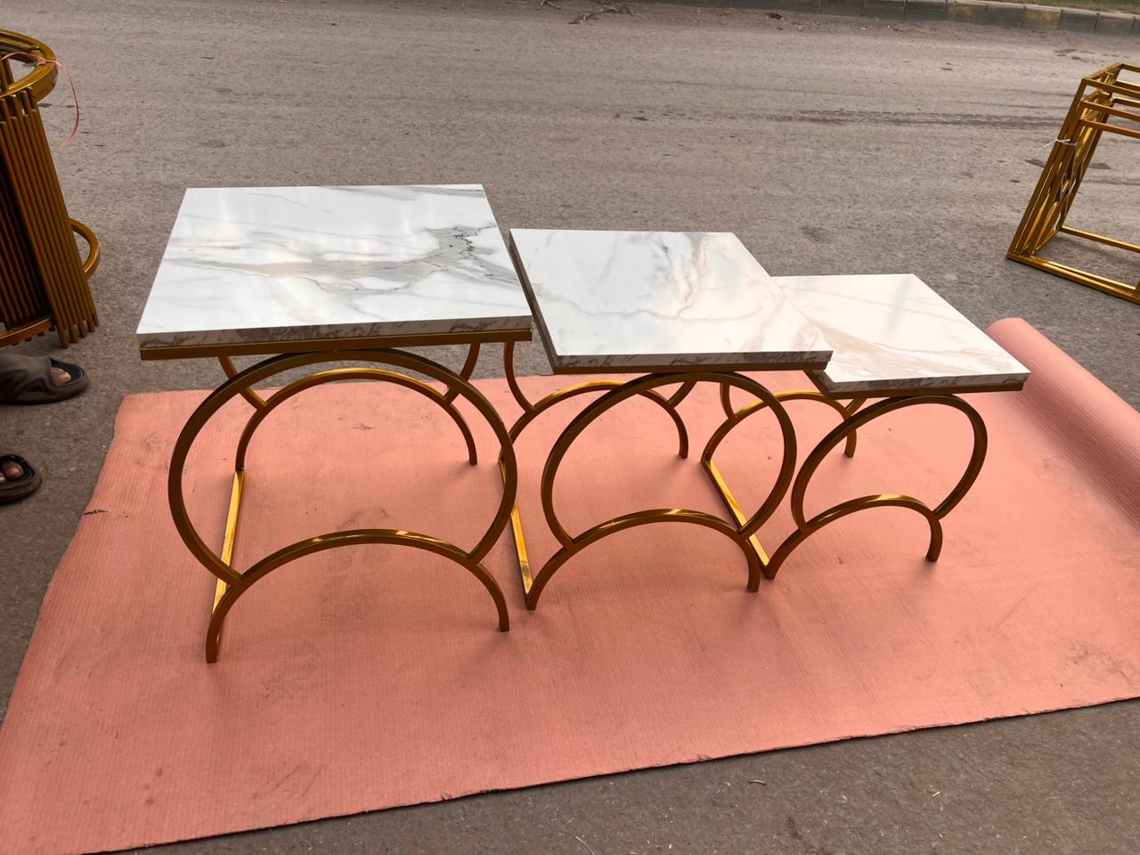 Modern Luxury Nesting Table Set Featuring Golden Metal Base and Smooth Marble Texture Tops