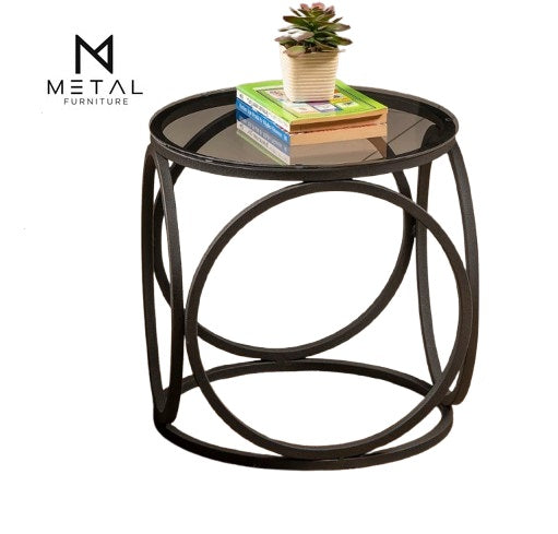 Modern metal frame coffee table with unique design, ideal as a bedside or sofa side table for stylish bedrooms.