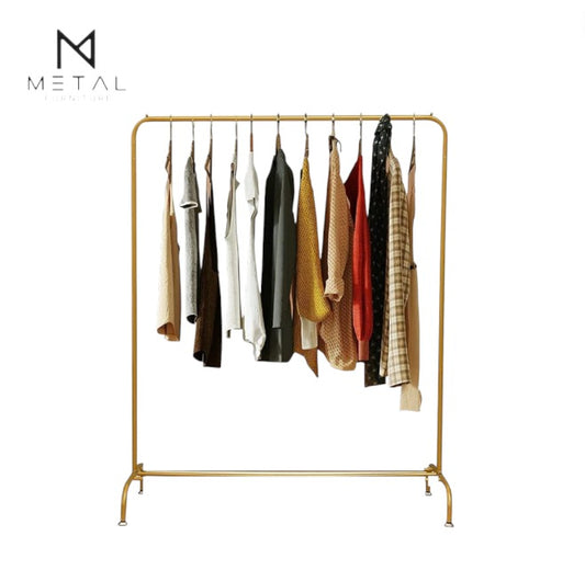 Golden metal clothing display rack with iron stand for women's garments, ideal for store use and organized presentation.