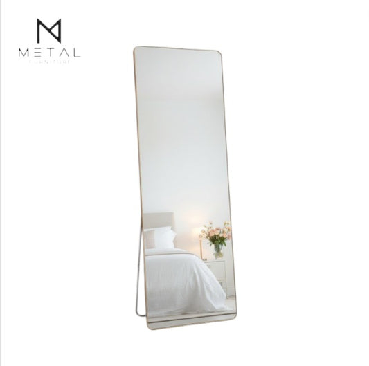 Unbreakable full-length wall mirror by Metal Furniture, modern leaning and wall-mounted design in a contemporary interior setting