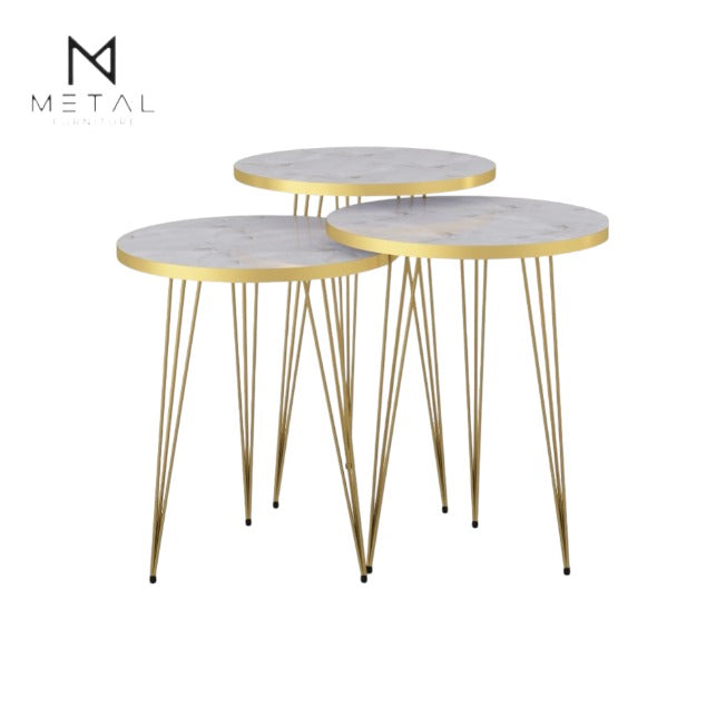 Three modern nesting tables by Metal Furniture with gold painted finish, showcasing sleek, minimalist design and varying heights.