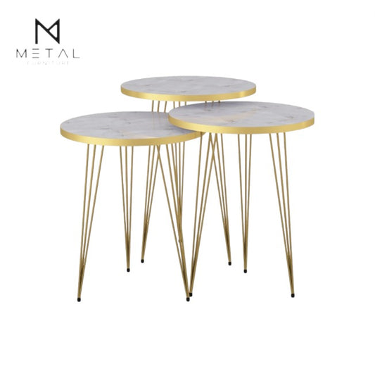 Three modern nesting tables by Metal Furniture with gold painted finish, showcasing sleek, minimalist design and varying heights.