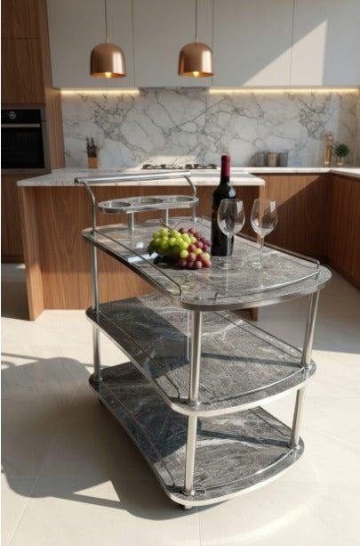 Modern kitchen with a marble-topped serving cart, wine bottle, and grapes.