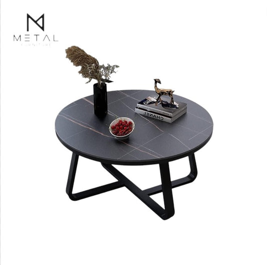 Gold finish round center table in living room with sleek metal design by Metal Furniture, showcasing its modern style.