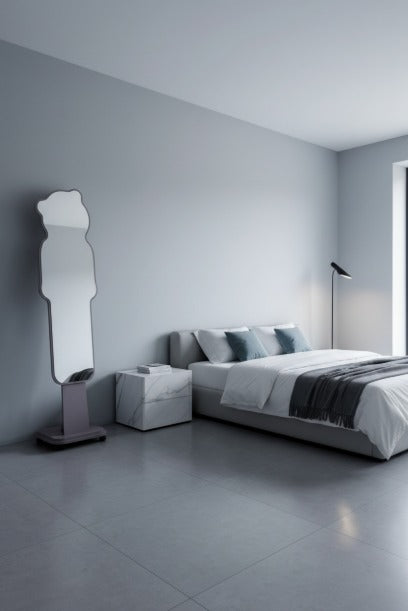 Modern bedroom with a bed, nightstands, and a tall mirror.
